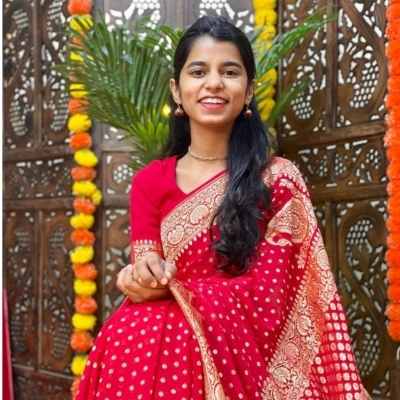 Maithili Thakur wearing red saree