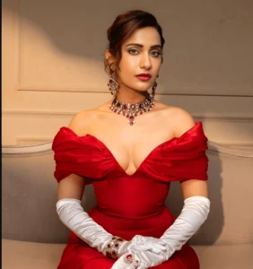 Kusha Kapila in red dress